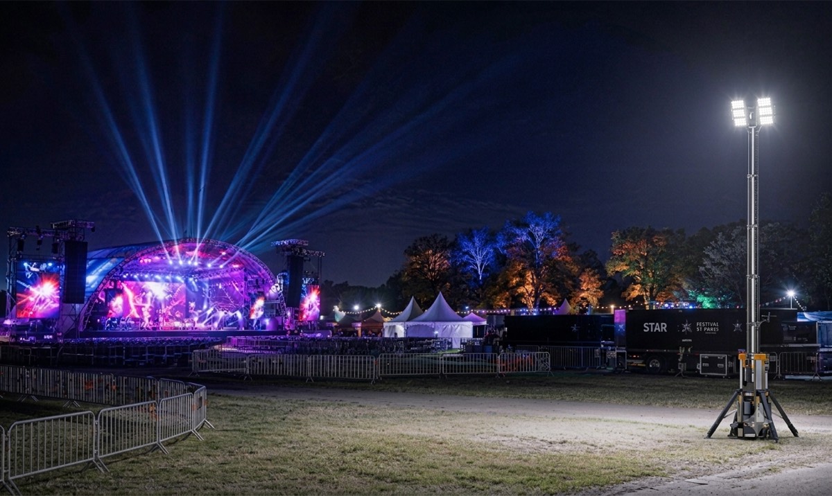 Litenza light tower at an outdoor concert and event site at night